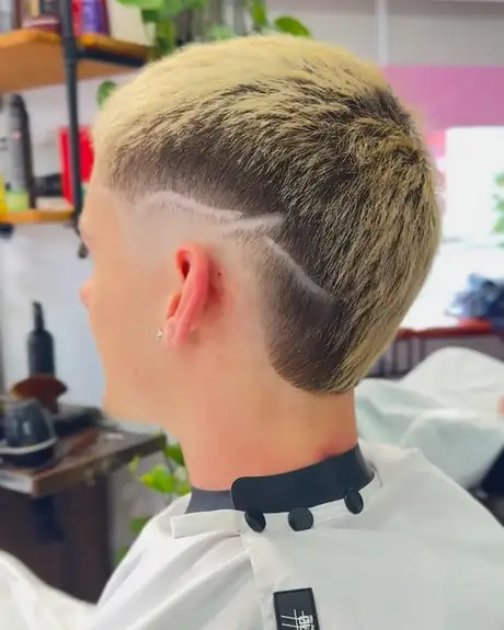 Blonde burst fade with a freestyle razor design