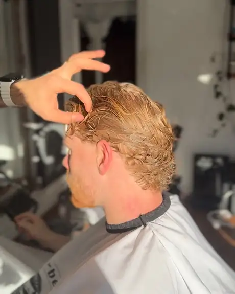Blonde waves being styled to finish